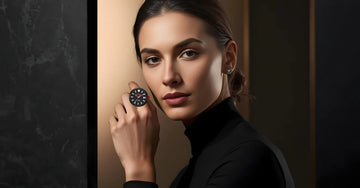 Woman wearing a modern black mechanical ring watch with bold dial design